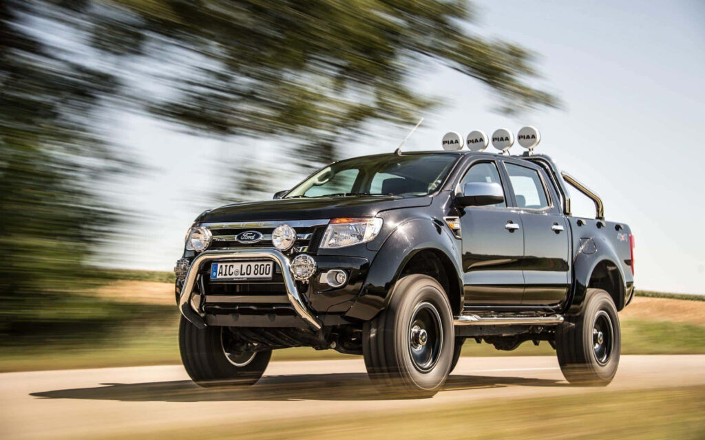 Ford Ranger Raptor off-road rugged truck driving adventurous trail nature background wallpaper