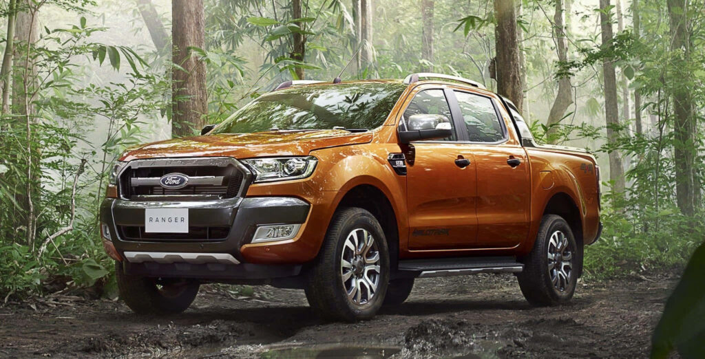 Ford Ranger rugged truck in green forest highlighting adventurous offroad capability wallpaper