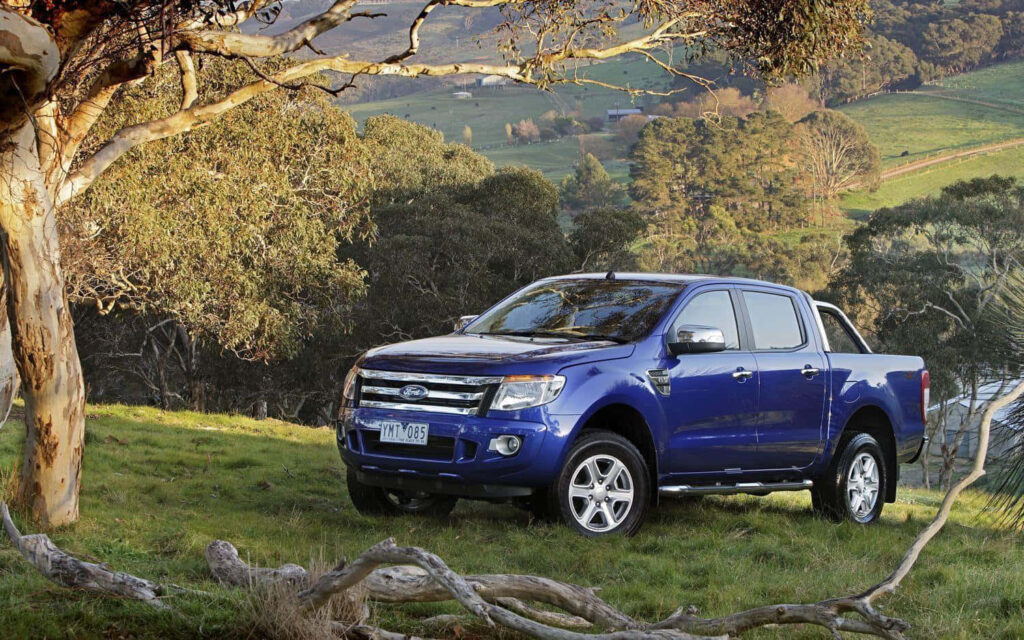 Ford Ranger parked in scenic countryside showcasing rugged design and adventurous spirit wallpaper