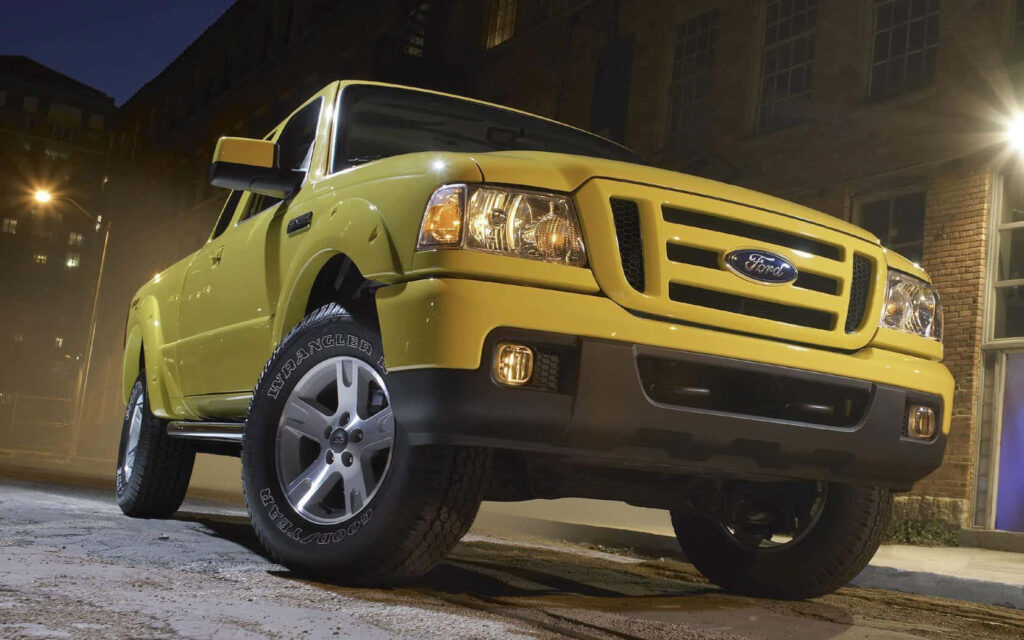 Ford Ranger in urban setting with dramatic lighting showcasing bold design and power wallpaper