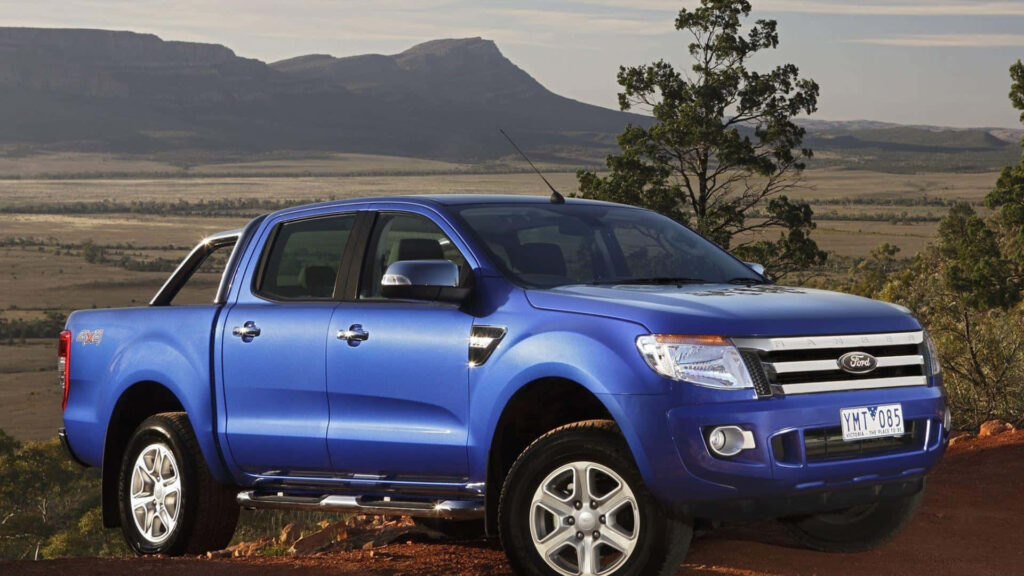 Ford Ranger truck wallpaper with dynamic countryside backdrop perfect for adventure enthusiasts