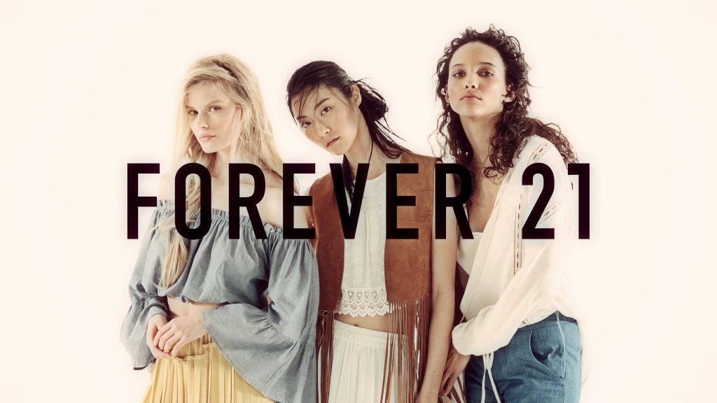 Forever 21 fashion wallpaper with three diverse women in bohemian casual wear on white background