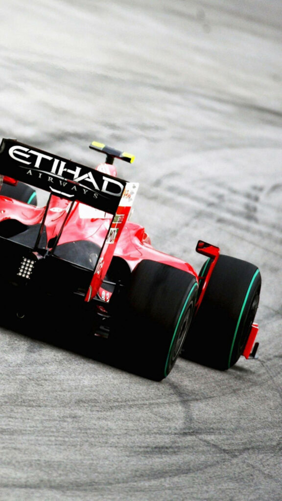 Red Formula 1 car with Etihad Airways logo racing fast on track vibrant speed wallpaper background