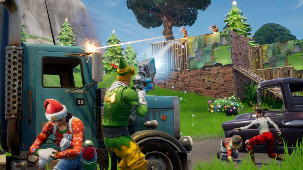 Fortnite Battle Royale festive battle with Codename ELF and Nog Ops near wooden fort wallpaper