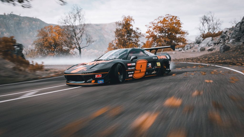 Black Acura NSX with widebody and racing livery drifting on misty autumn mountain pass Wallpaper