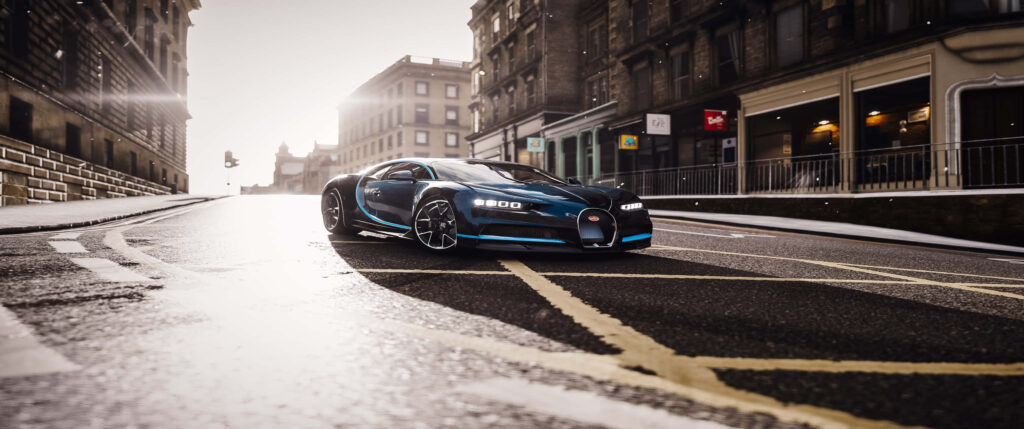 Ultra-wide Forza Horizon 4 screenshot Bugatti racing sunlit city streets 3440x1440p wallpaper