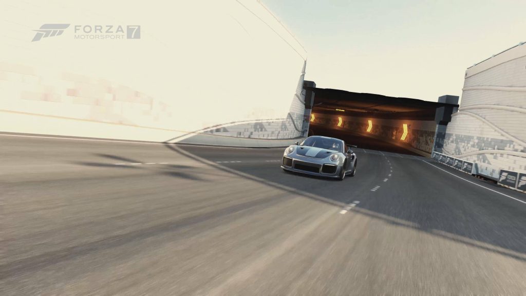 Silver Porsche 911 GT2 RS racing toward track tunnel in Forza Motorsport 7 high-speed wallpaper