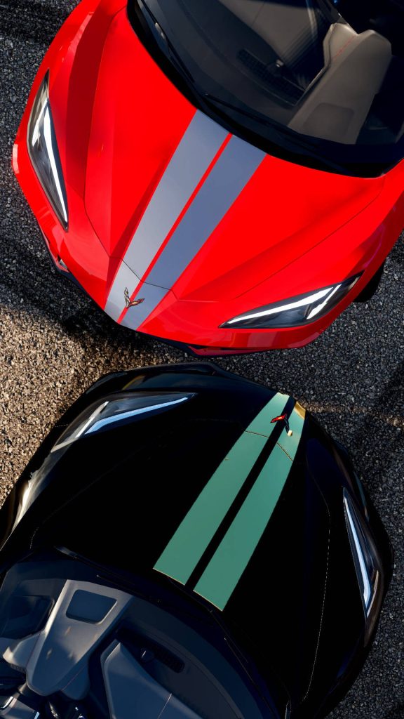 Top-down view of two Chevrolet Corvette C8 supercars red and black racing stripes on track Wallpaper