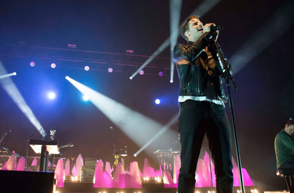 Foster the People live performance Mark Foster singing black leather jacket purple stage lights Wallpaper