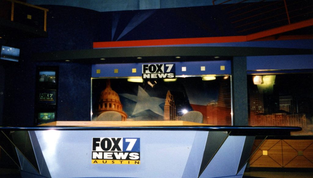 Fox 7 News Austin studio with Texas Capitol dome city skyline and sleek blue broadcast set Wallpaper