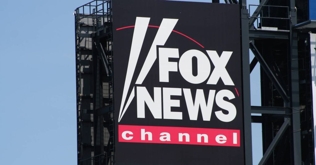 Fox News Channel logo on large outdoor billboard with bright sky professional wallpaper background