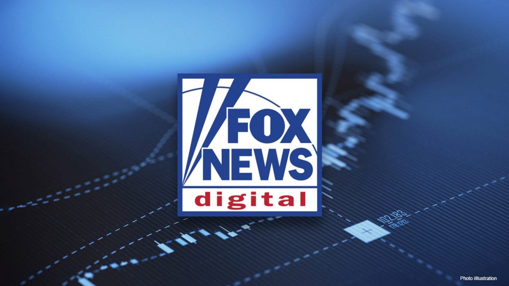 Fox News digital wallpaper with official branding over deep blue abstract financial data background