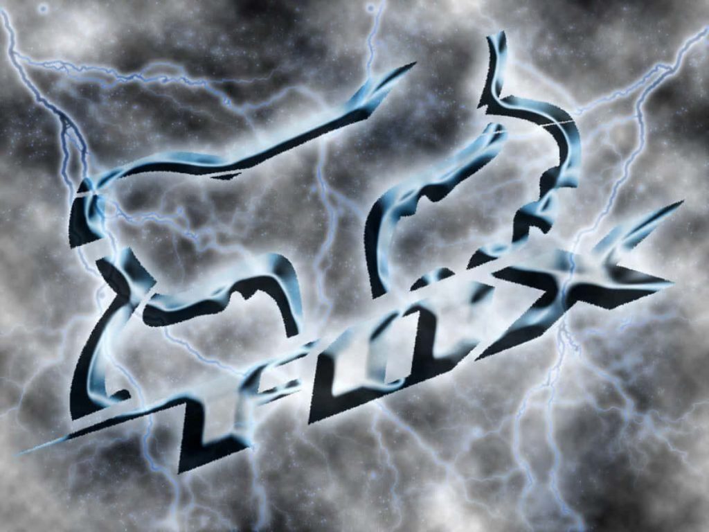 Fox Racing logo with blue white lightning on dark intense motocross background wallpaper