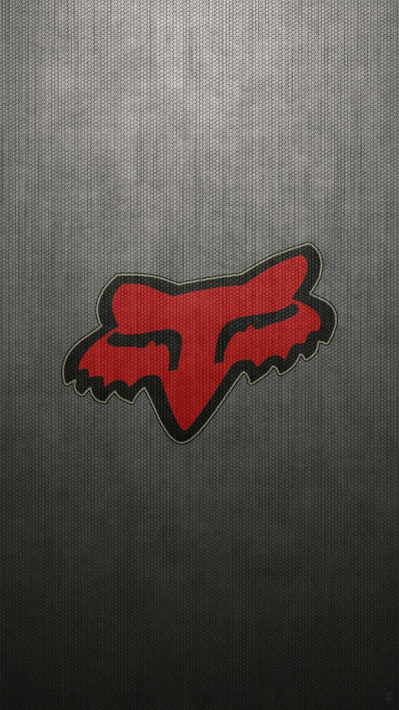 Fox Racing wallpaper with red Fox Head logo on dark textured hexagonal mesh background