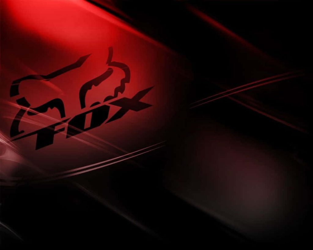 Fox Racing wallpaper with iconic logo and bold red light streaks on dark background design