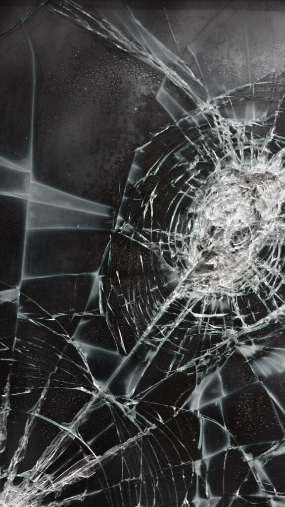Frozen Abstract: A mesmerizing monochromatic artwork capturing fractured ice with cracked screen patterns. Wallpaper