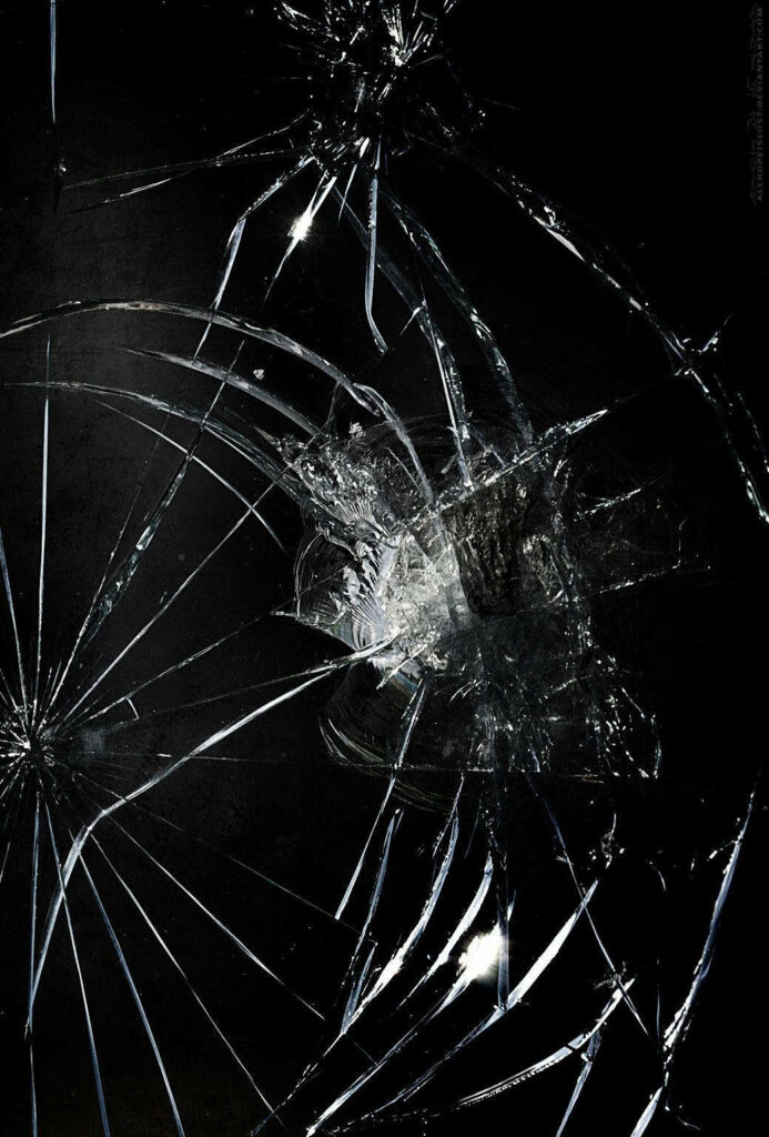 Unveiling the Flaws: A Stunning Dark Mobile Screen Wallpaper with a Prominent Surface Crack
