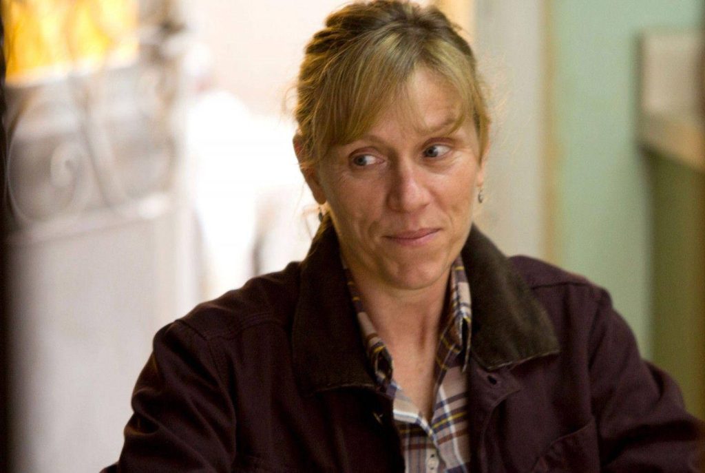 Frances McDormand as Sue Thomason in Promised Land brown jacket plaid shirt thoughtful expression Wallpaper