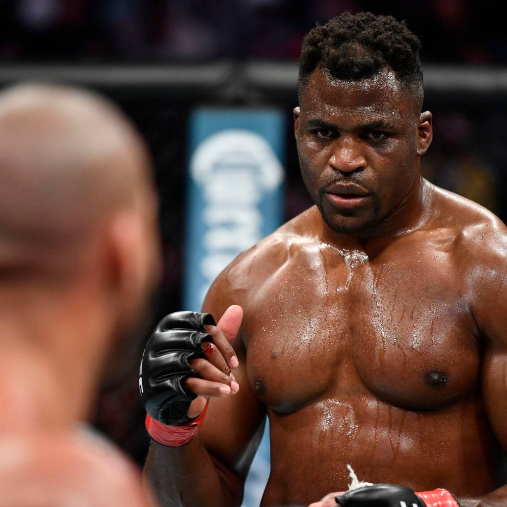 Francis Ngannou intense sweaty gaze inside octagon MMA fighter high definition sports wallpaper