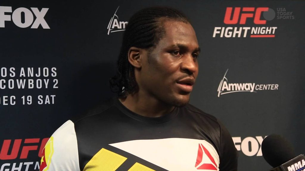 Francis Ngannou UFC Fight Night interview in Reebok gear Amway Center press backdrop wallpaper