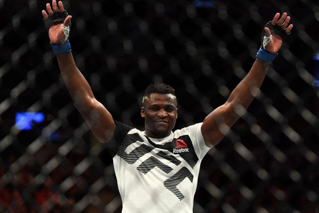 Francis Ngannou UFC victory wallpaper high quality MMA fighter Reebok kit inside Octagon