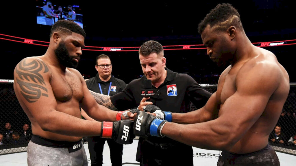 Francis Ngannou versus Curtis Blaydes UFC faceoff in Octagon intense pre fight moment wallpaper