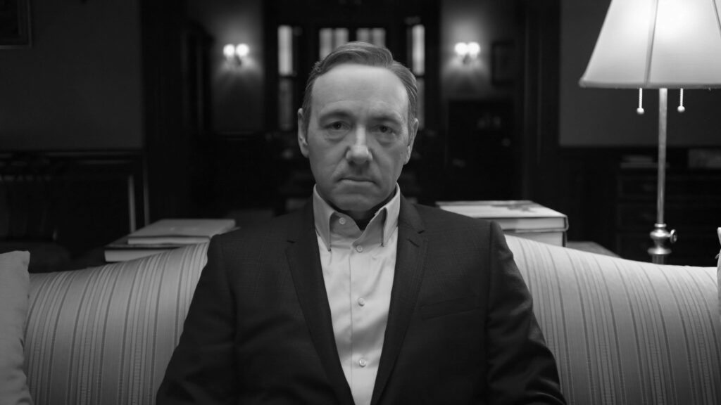 Powerful Francis Underwood Wallpaper: Striped Couch Scene