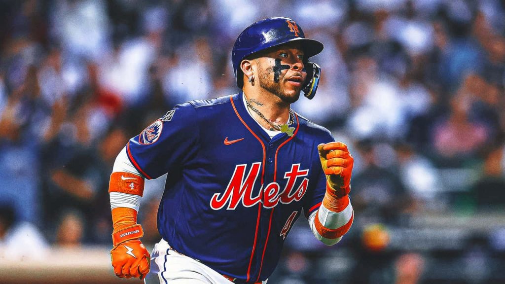 Francisco Alvarez in blue NY Mets jersey with orange gear intense action baseball wallpaper