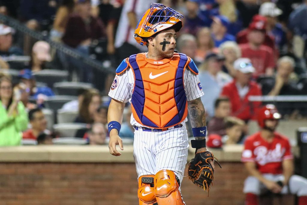 High-definition action photo of Mets catcher Francisco Alvarez in blue orange gear and The Troll chest protector Wallpaper