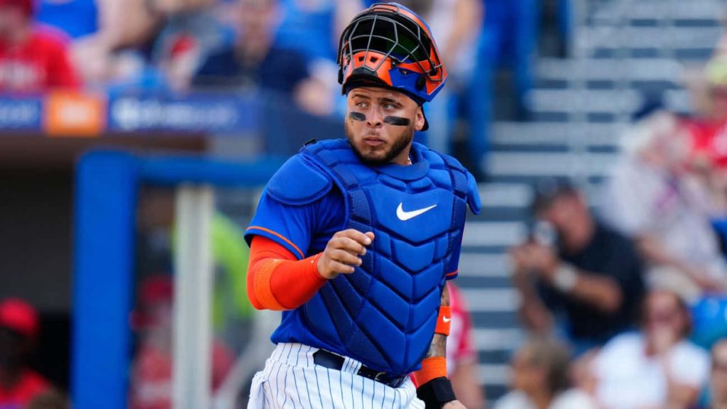 Francisco Alvarez New York Mets catcher in blue orange gear caught during intense MLB game action Wallpaper