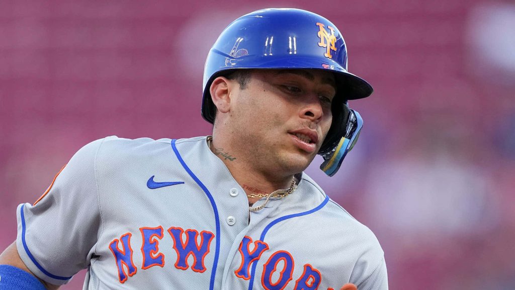 Francisco Alvarez New York Mets catcher in grey uniform blue helmet focused MLB action wallpaper