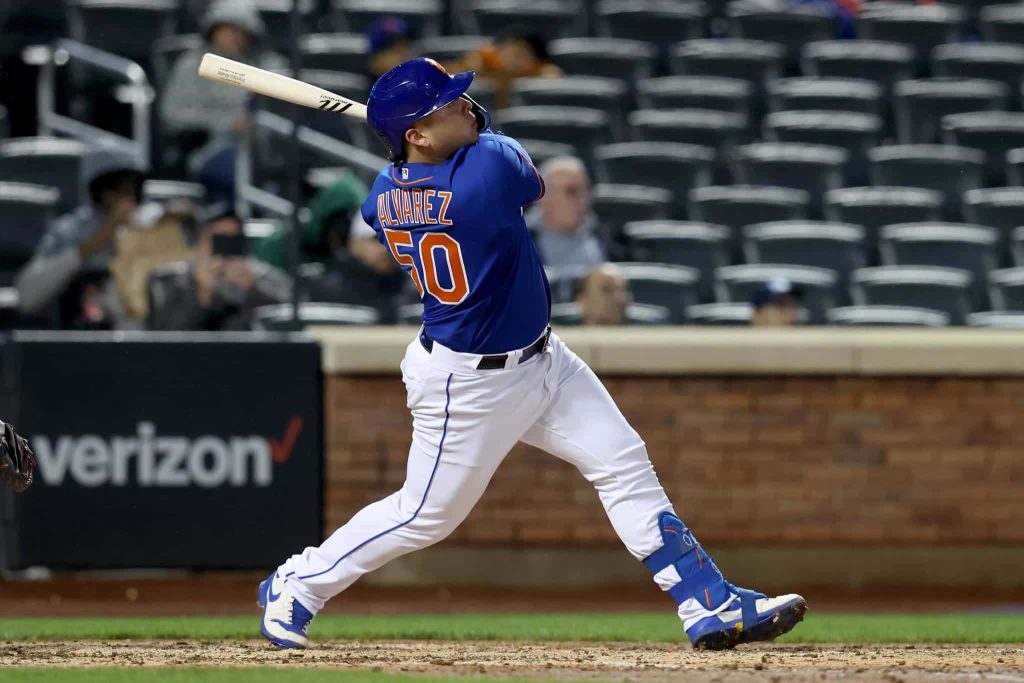 Francisco Alvarez New York Mets catcher mid-swing blue uniform baseball action wallpaper