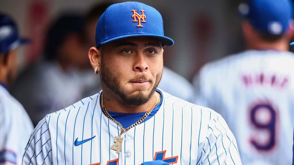 Francisco Alvarez New York Mets catcher in white pinstriped jersey blue cap intense focus wallpaper