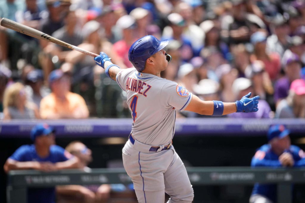 Francisco Álvarez #4 Mets catcher swinging powerfully in stadium action baseball wallpaper