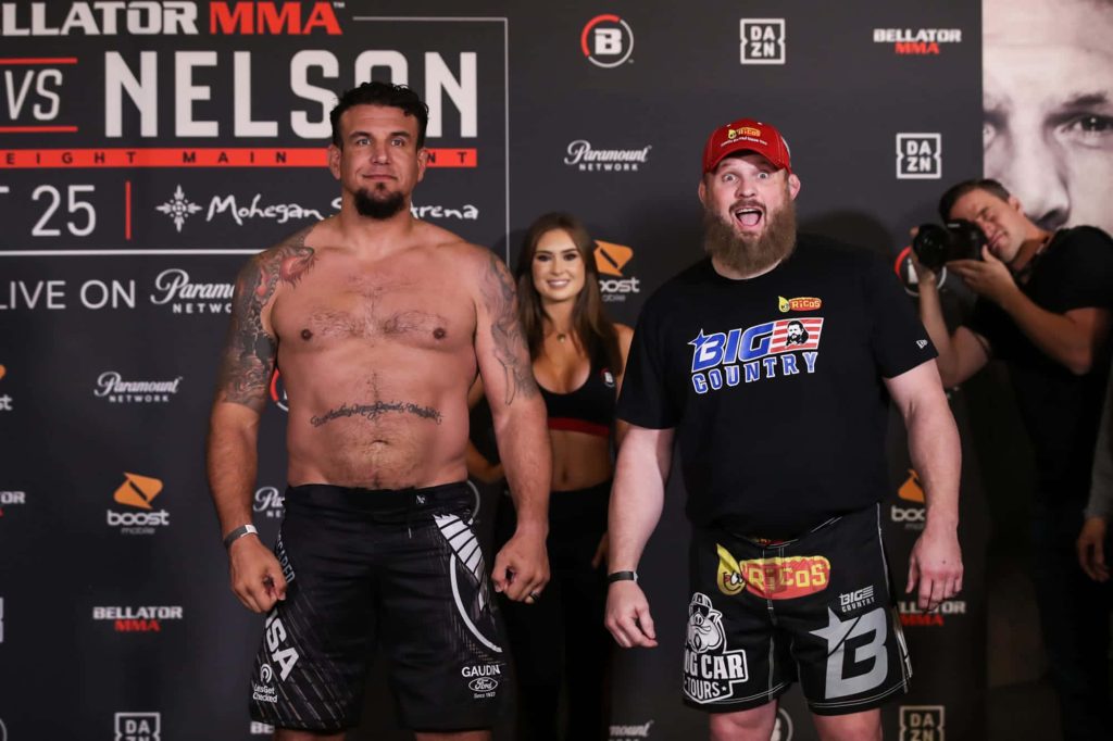 Bellator MMA weigh-in Frank Mir and Roy Nelson intense heavyweight face-off with model background Wallpaper