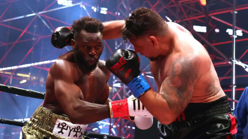 Frank Mir vs Steve Cunningham intense boxing match in red-lit Triller Fight Club ring wallpaper
