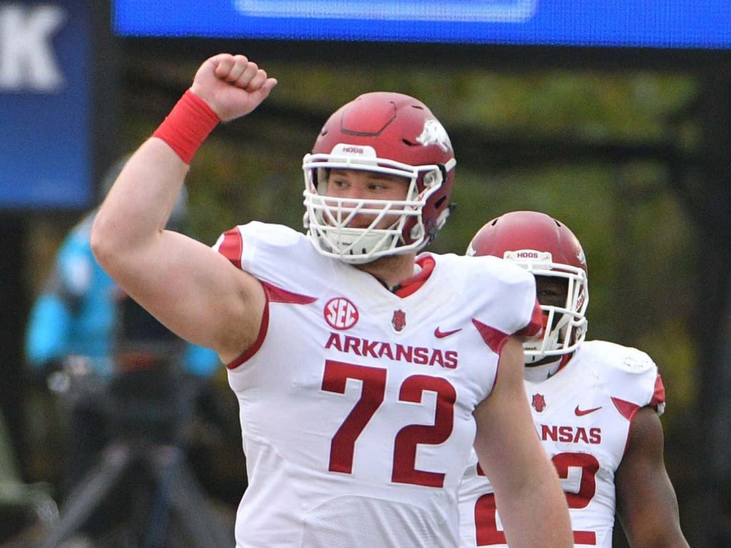 Frank Ragnow in white 72 jersey celebrates Arkansas Razorbacks spirit in dynamic sports wallpaper