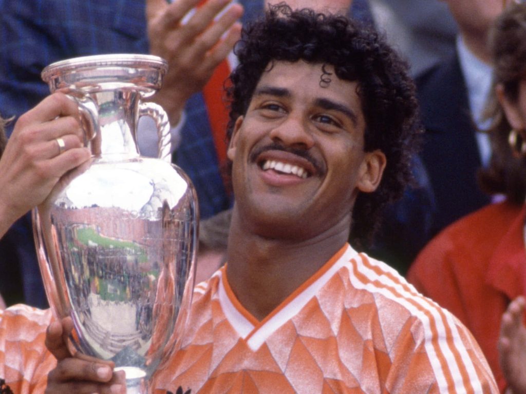 Frank Rijkaard in 1988 Netherlands kit holding UEFA Euro trophy vintage football wallpaper