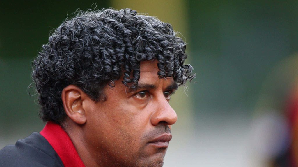 High-resolution side-profile portrait of legendary Dutch footballer Frank Rijkaard wallpaper background