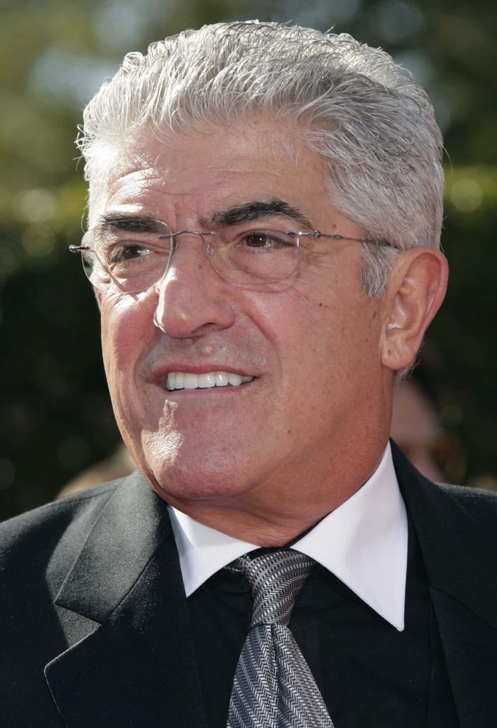 Portrait of American actor Frank Vincent with silver hair glasses and sharp suit in natural light Wallpaper