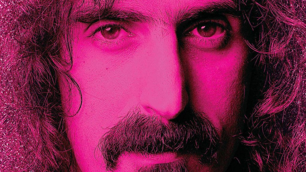 Extreme close-up of Frank Zappa with hot pink lighting vibrant psychedelic wallpaper background