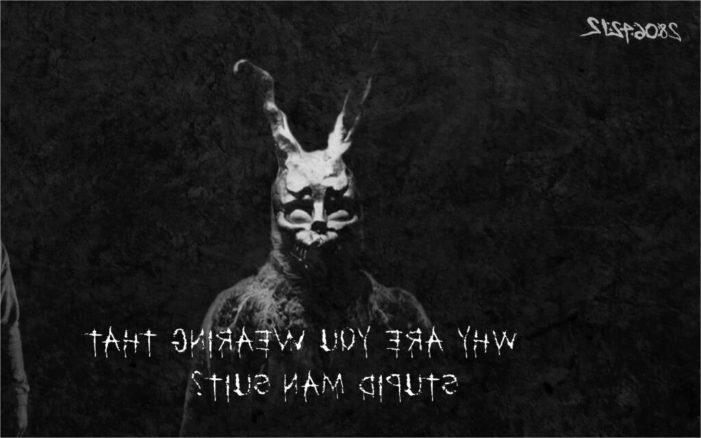 Frank the Rabbit from Donnie Darko grayscale wallpaper with eerie mask on dark textured background