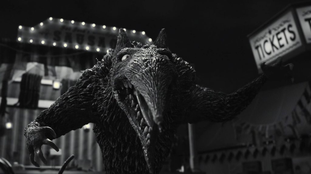 Black and white Were-rat from Tim Burton Frankenweenie with spooky carnival and Tickets sign wallpaper