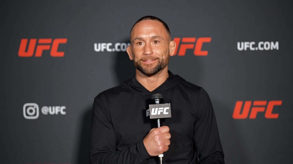 Frankie Edgar UFC interview portrait grey backdrop branded microphone MMA fighter wallpaper