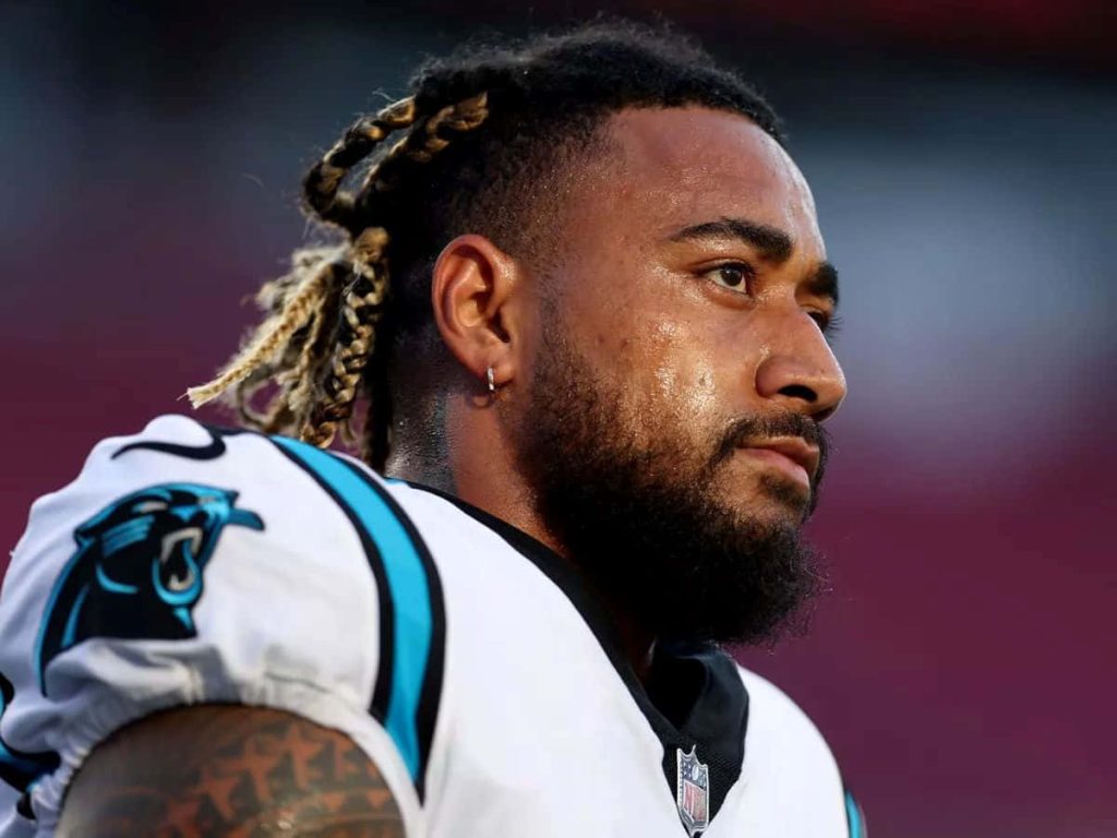 Frankie Luvu Carolina Panthers linebacker intense focused pose white jersey sports wallpaper