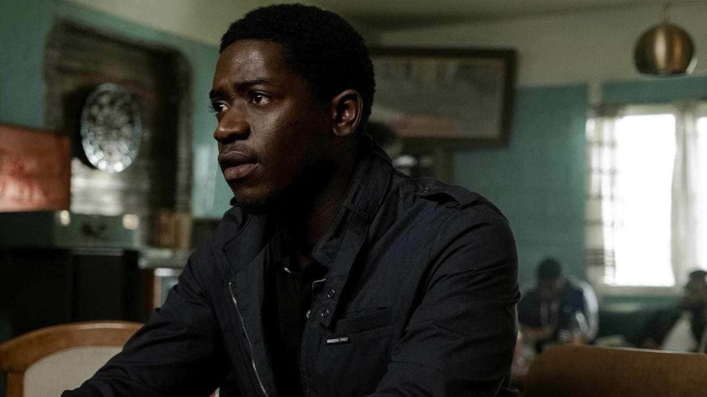 Franklin Saint intense gaze in dark jacket moody interior cinematic Snowfall wallpaper background