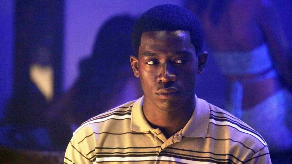 Franklin Saint portrait by Damson Idris Snowfall neon-lit intense focused gaze wallpaper background