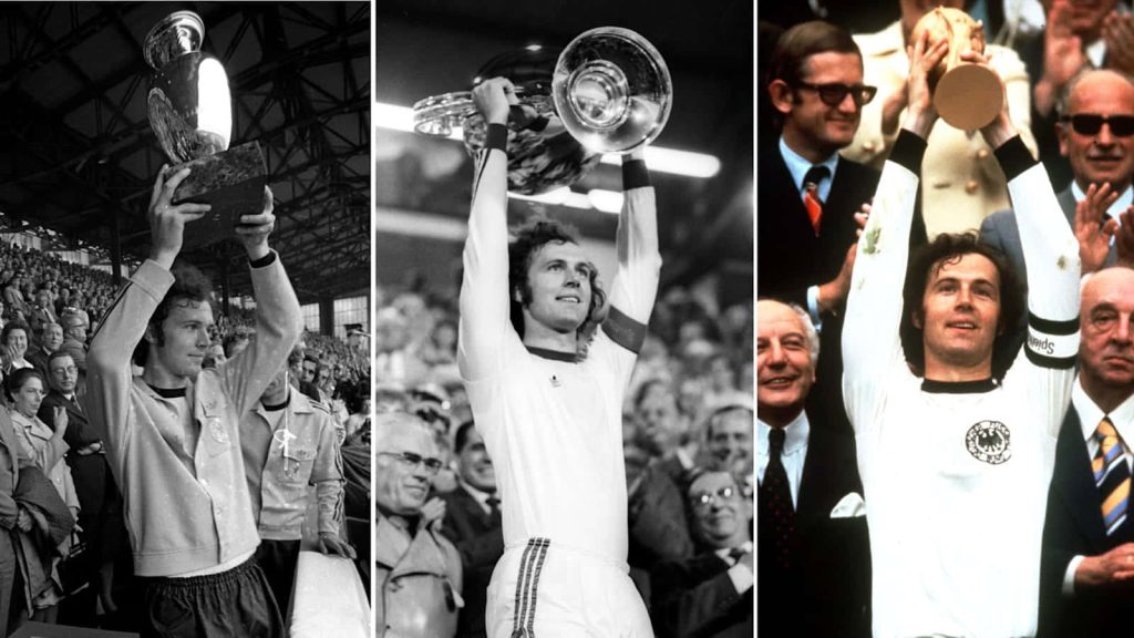Triptych wallpaper of Franz Beckenbauer lifting FIFA World Cup and European Cup trophies
