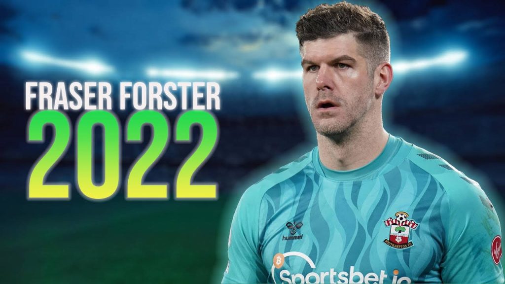 Goalkeeper Fraser Forster in Southampton FC kit ready to save in floodlit stadium wallpaper