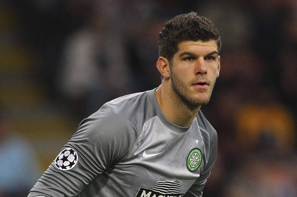 Goalkeeper Fraser Forster in gray Celtic FC jersey with UEFA Champions League patch intense pose Wallpaper